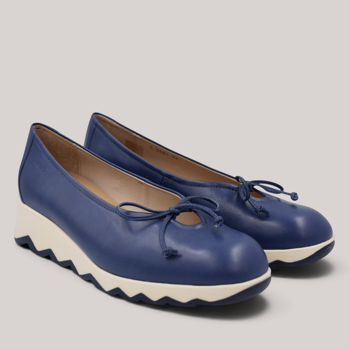 Grundy's Shoes Wonders 7621 blue leather ballet wedge shoes with a bow detail and white slip-resistant sole.