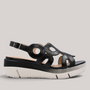 Grundy's Shoes Wonders 8282 black patent leather wedge sandals with circular cutouts and adjustable buckle strap