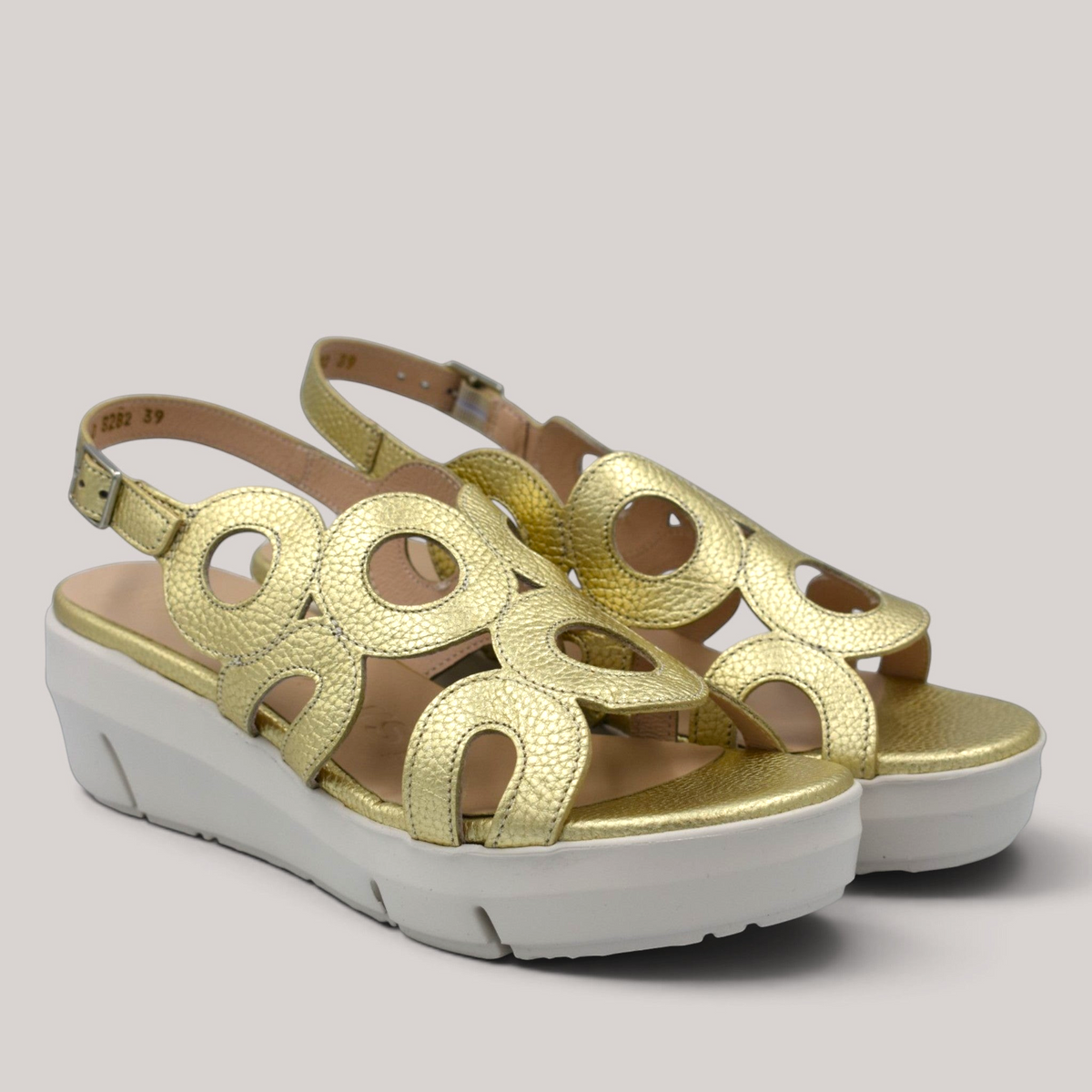 Grundy's Shoes Wonders 8282 metallic gold leather wedge sandals with circular cutouts and adjustable buckle strap