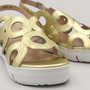Grundy's Shoes Wonders 8282 metallic gold leather sandals with circular cutouts and a lightweight white wedge sole.
