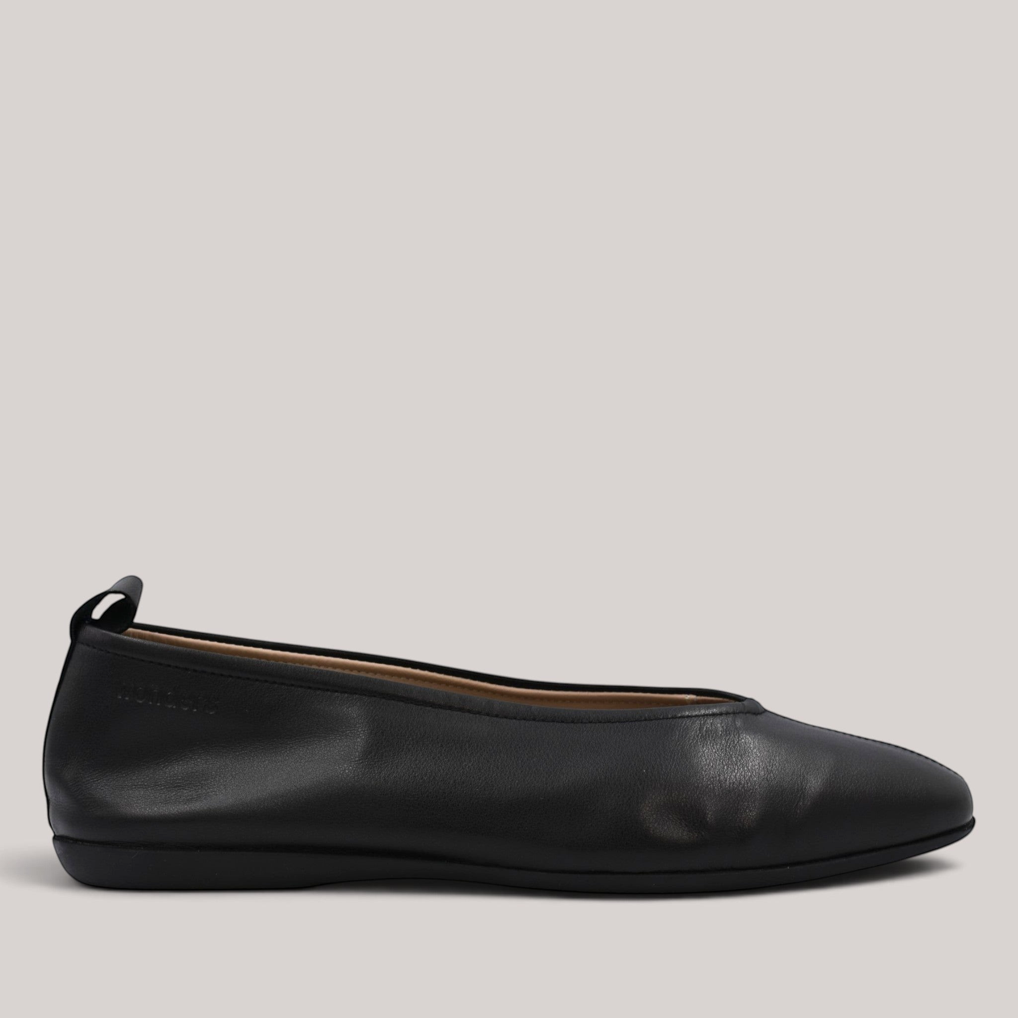 Grundy's Shoes Wonders 8661 black soft leather ballet flats with a rounded toe and back pull tab.