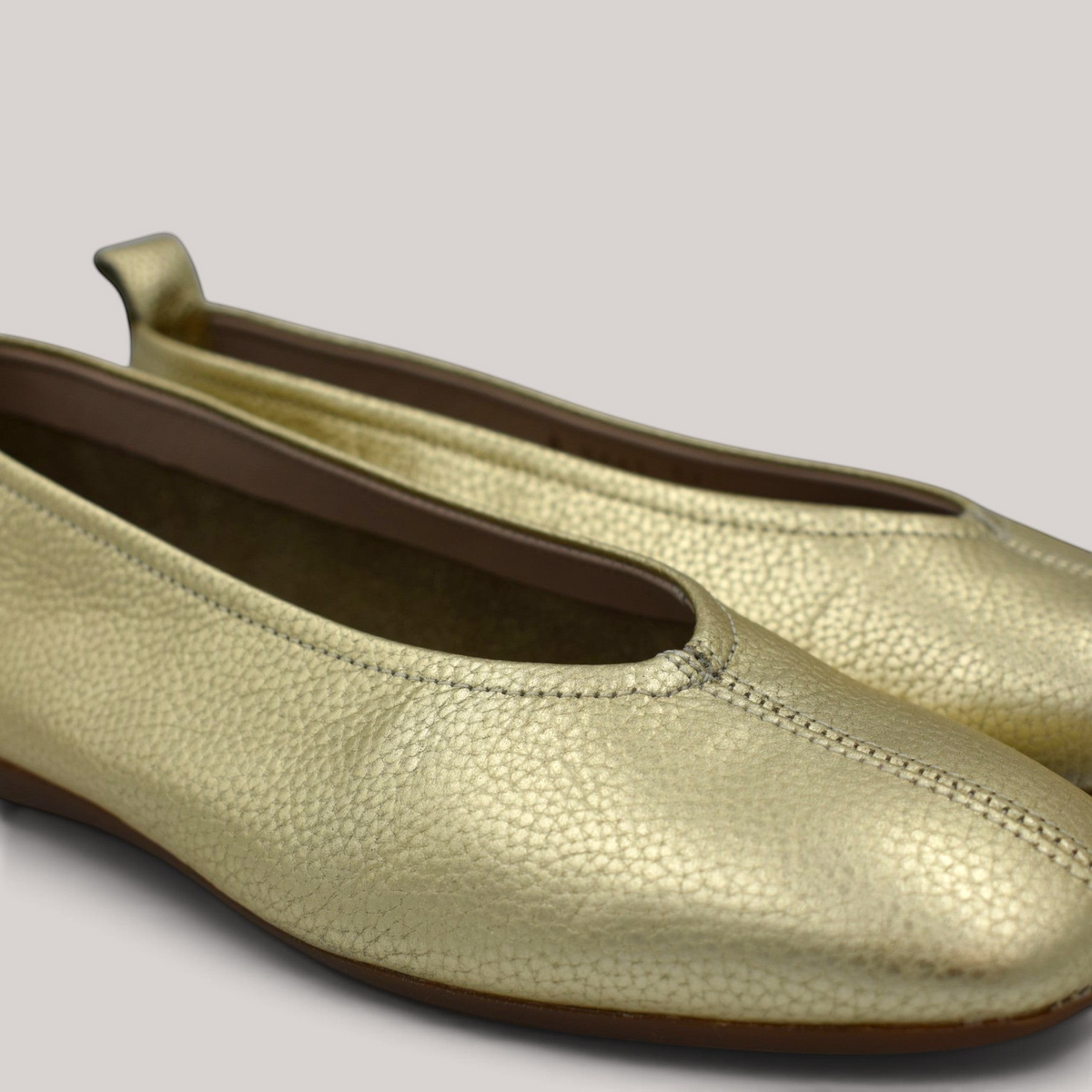 Grundy's Shoes Wonders 8661 metallic gold leather ballet flats with a cushioned MemoryGel insole and back pull tab.