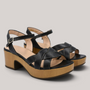 Grundy's Shoes Wonders 8860 black leather sandals with crossed straps, adjustable buckle, and wooden platform heel.