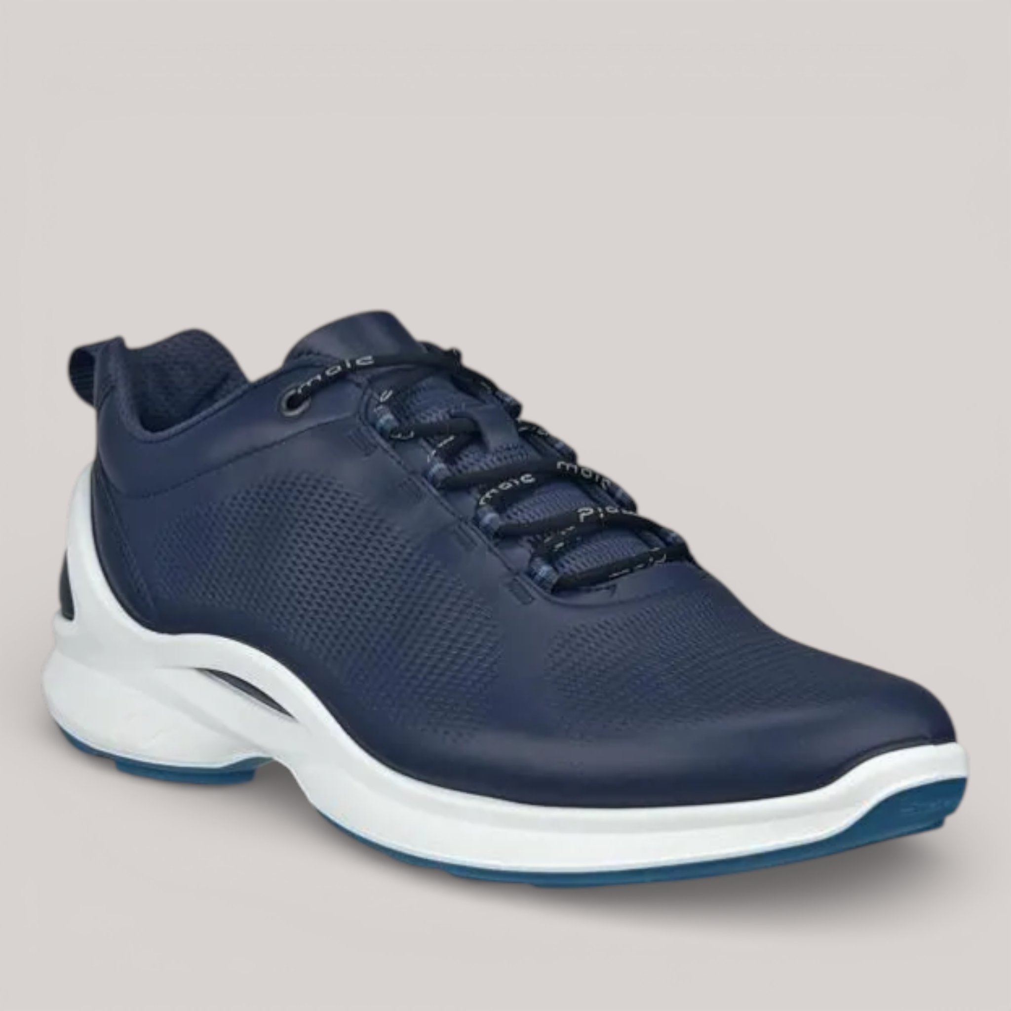 Grundy's Shoes navy blue DriTan leather men's athletic shoe with padded collar and white sole.