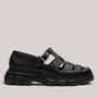 Grundy's Shoes Paul Green black leather fisherman sandal with a chunky lug sole and adjustable side buckle.